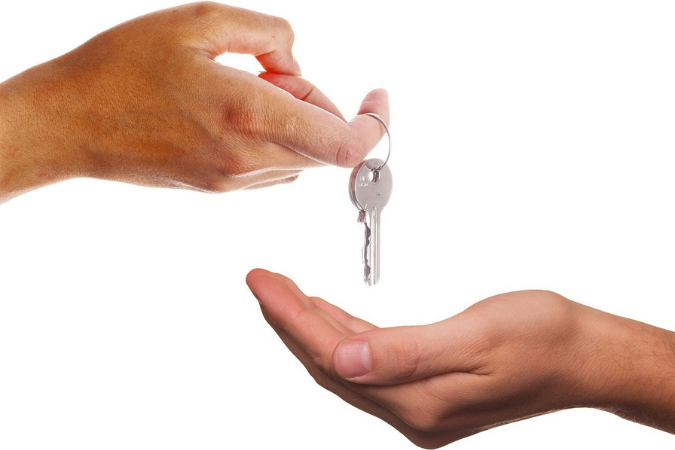 Landlord handing keys to tenant