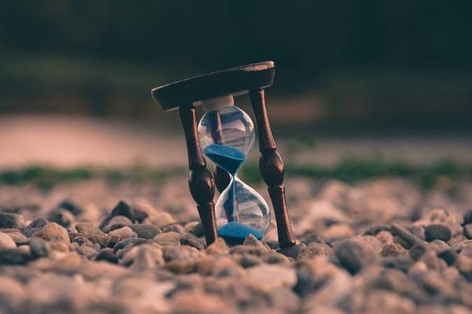 An hourglass in sand